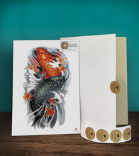Load image into Gallery viewer, Tintak temporary tattoo sticker with colored koi fish design, with its hard board packaging.