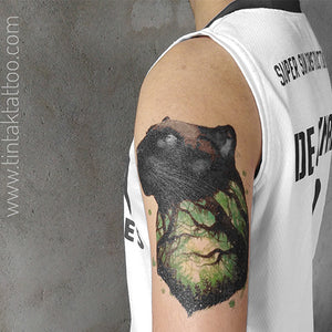 Black Panther temporary tattoo on a man's arm.