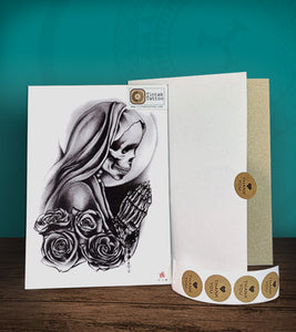 Tintak temporary tattoo sticker with praying skeleton nun design, with its hard board packaging.