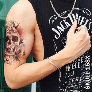 Roses and skull temporary tattoo on a man's upper arm.