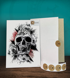 Tintak temporary tattoo with skull design, with its hard board packaging.