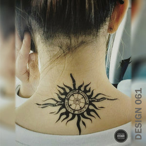 Tribal compass temporary tattoo on a woman's nape.