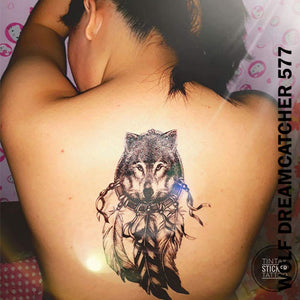 Woman's back with a wolf dream catcher temporary tattoo sticker.