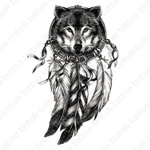 Load image into Gallery viewer, Black and gray dream catcher temporary tattoo design with the face of a wolf inside the circle.
